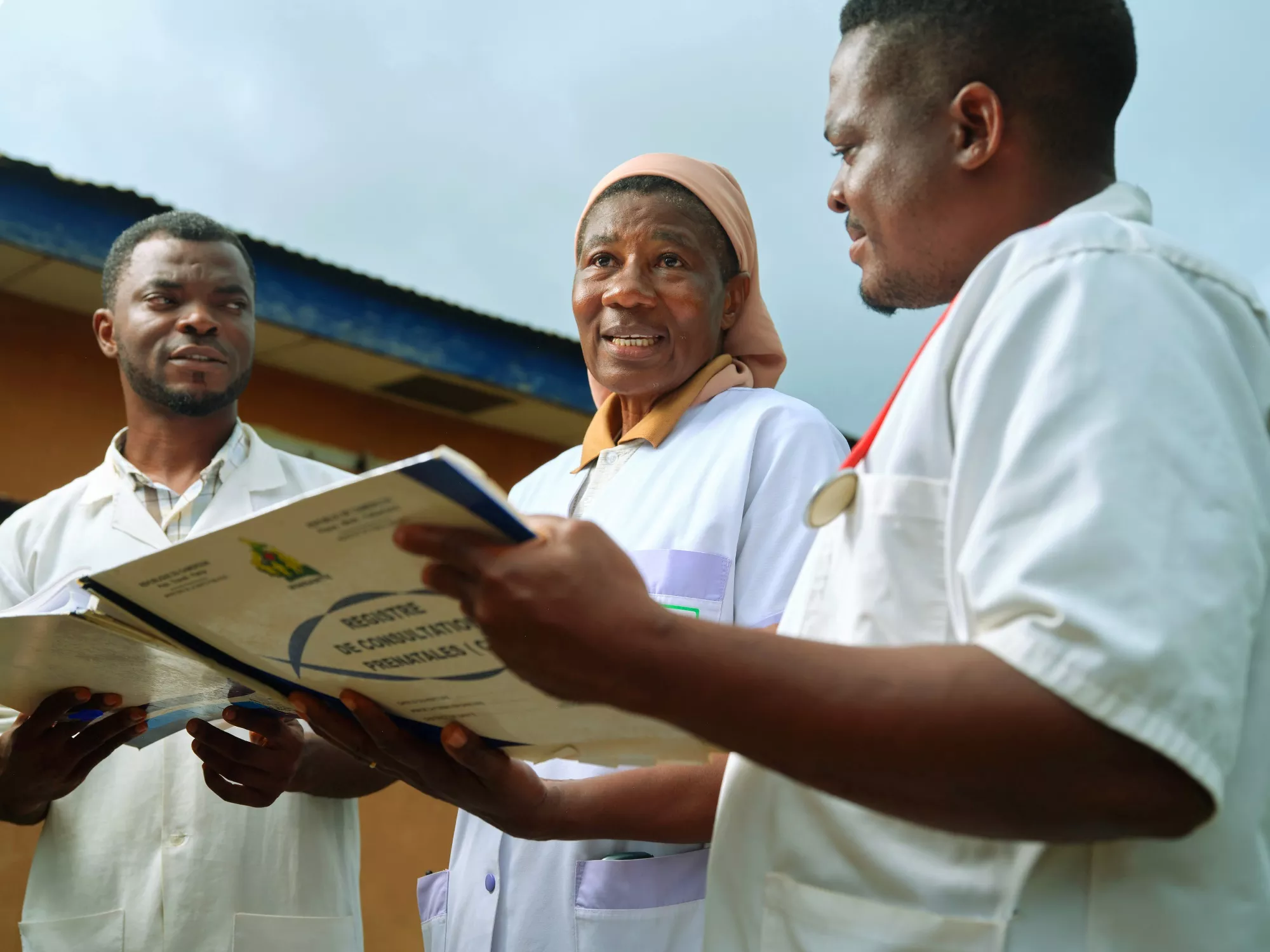 Sister Martine with nurses Thomas Ngue and Richard Bitomo at the Catholic mission’s health center in Ntui，in the Grand Mbam region of central Cameroon。