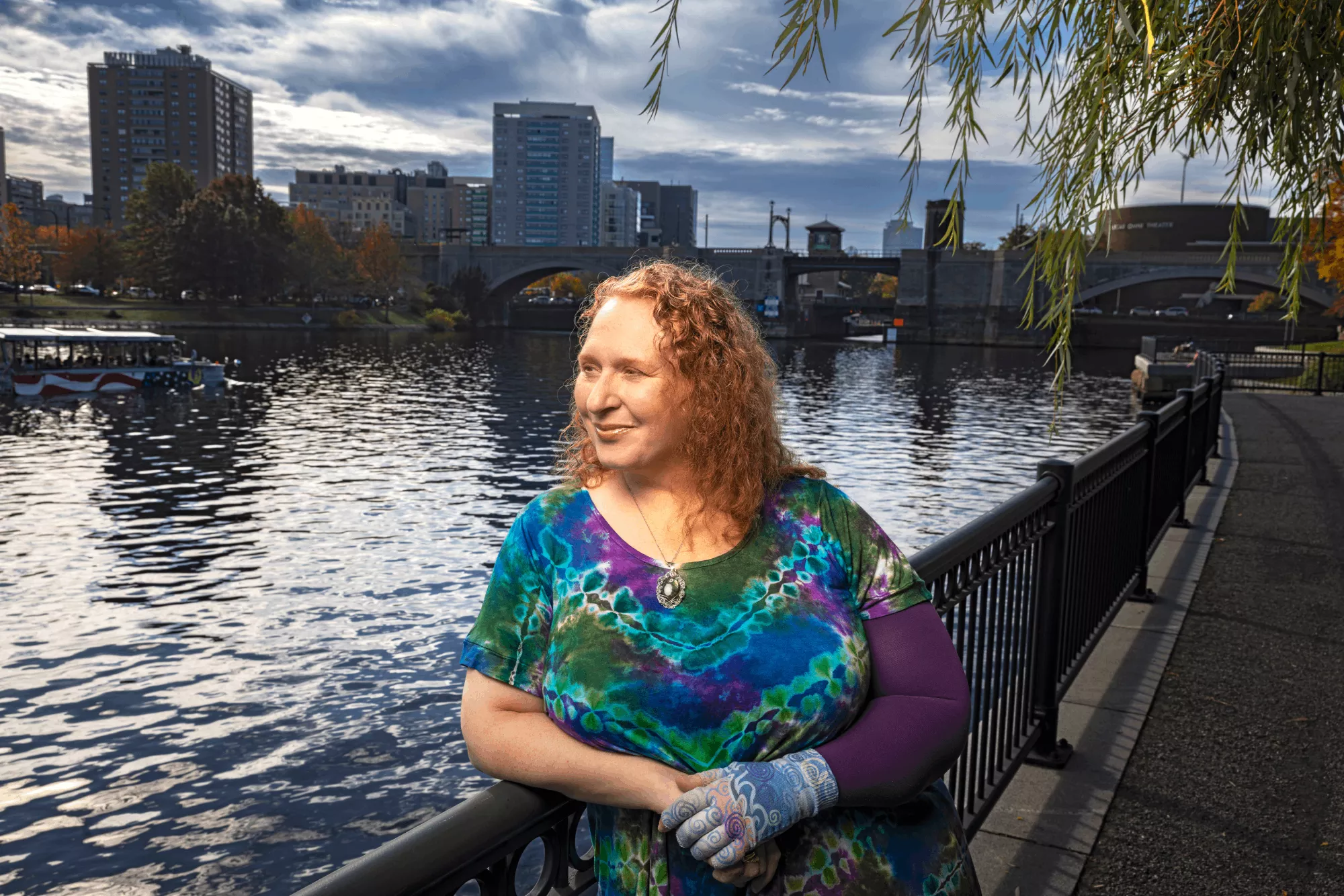  Laurie stands next to the Charles River in Boston.