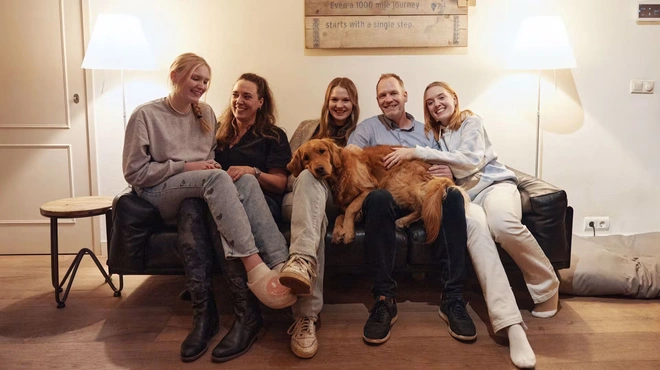 Marc Rijken family sitting on a sofa Marc Rijken family sitting on a sofa
