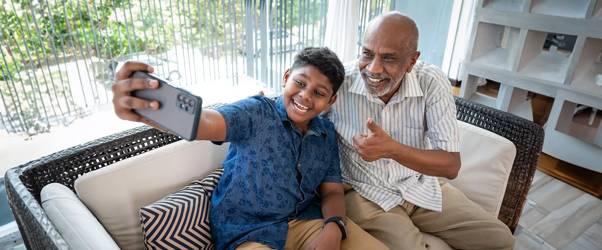 Grandfather taking selfie with grandchild