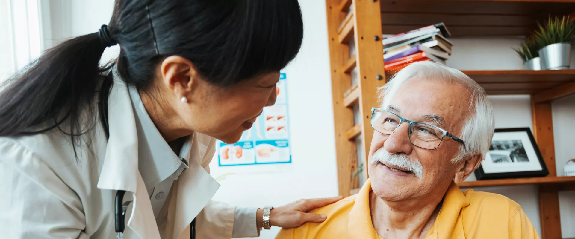 Doctor having conversation with an elderly patient