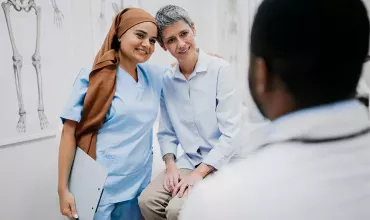 A nurse and a patient enjoying a warm moment