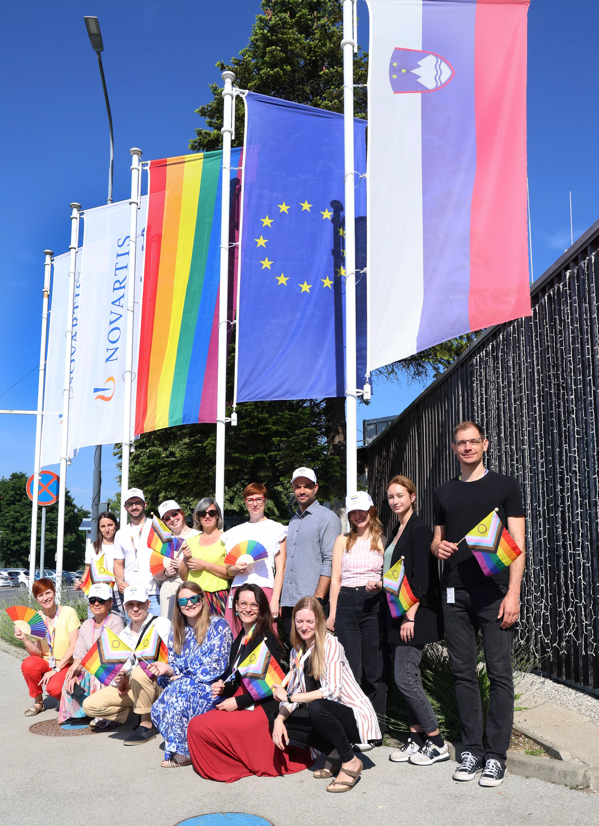 Raising the rainbow flag in front of the Novartis location in Mengš