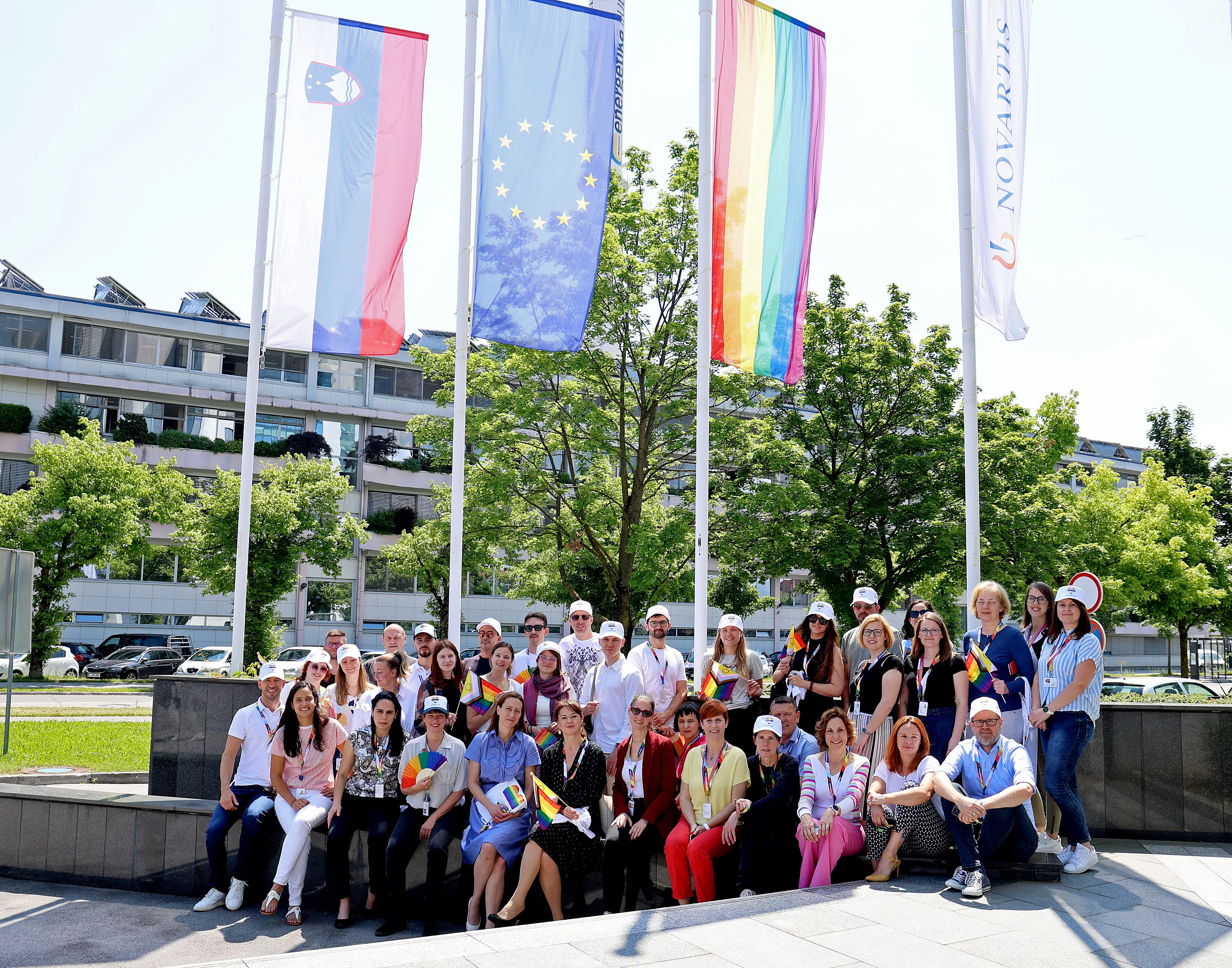 Raising the rainbow flag in front of the Novartis office building in Ljubljana