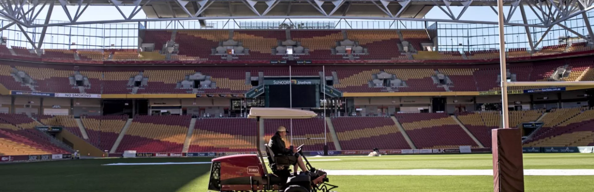 Groundskeeper Malcolm Caddies mows the grass in Brisbane, Australia