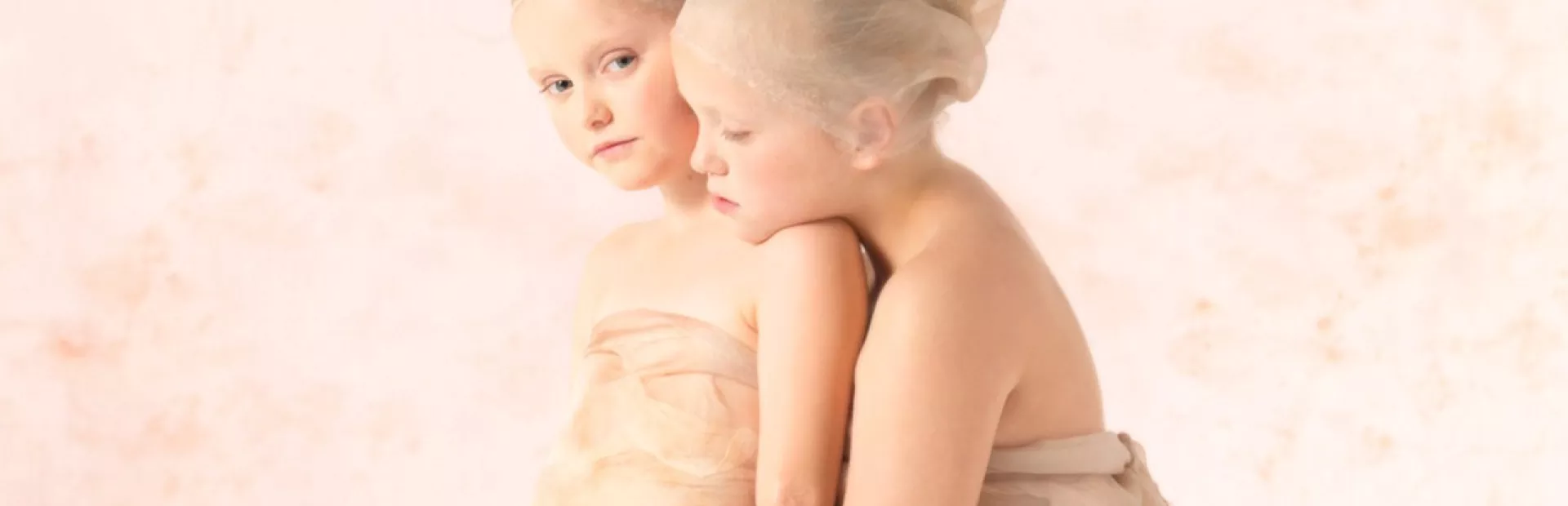 Two young girls posing for photoshoot