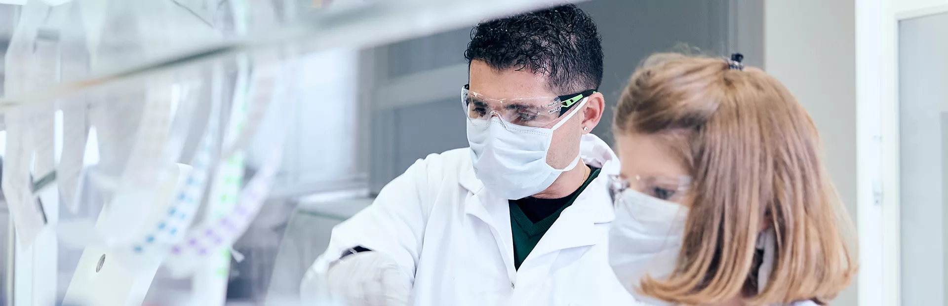 Scientists working together in a biomedical research lab.