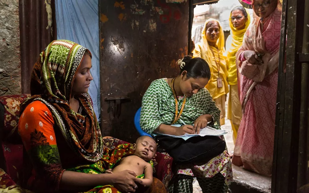 They interview Fatima, the mother of 6-month-old Foysal, who has symptoms of pneumonia.