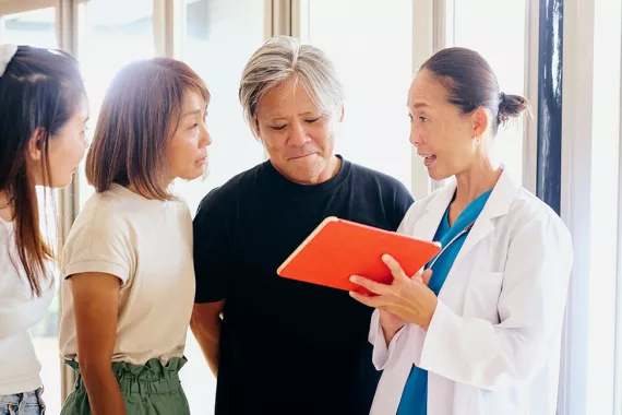 Japan ese doctor and patients discussing illness