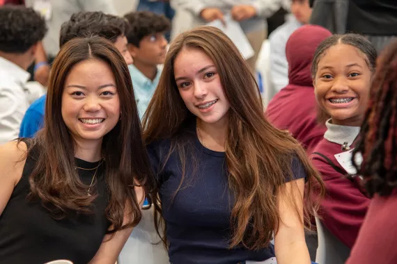 Three girls smiling at the camera